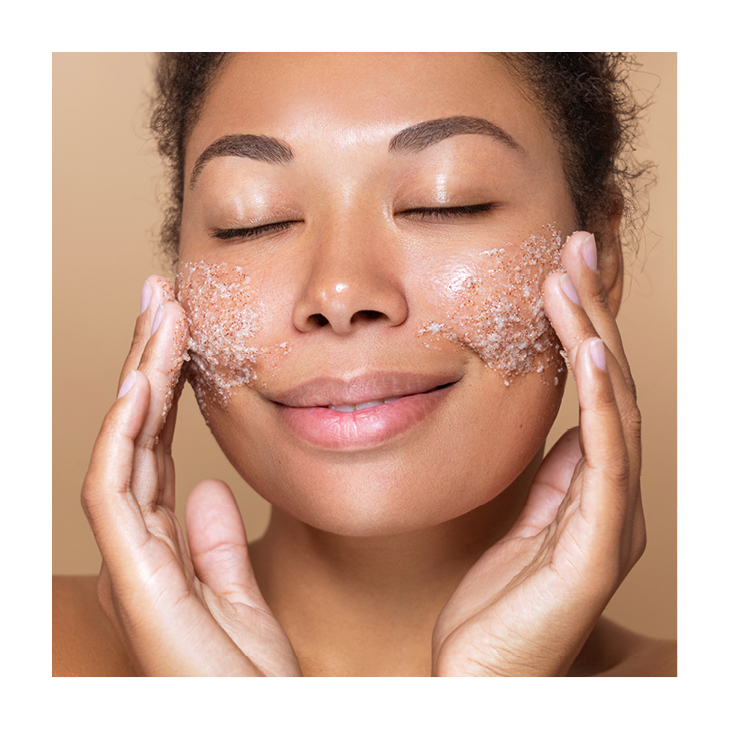 Image of a person applying a facial scrub
