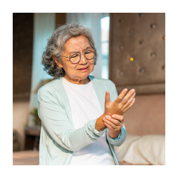 Image of person grabbing their wrist