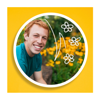 Person standing beside flowers
