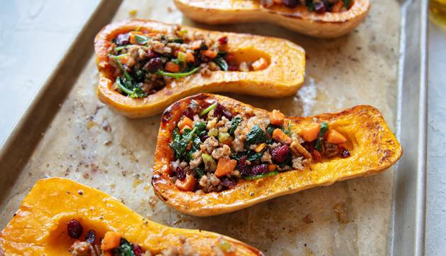 Sausage-Stuffed Butternut Squash With Spinach, Pecans, and Cranberries